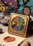 Colorful face design on a gold plaque with 'Melbourne Laneway' text, against a textured background.